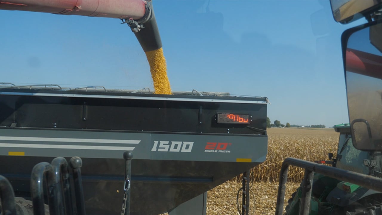 HEIGHT ADJUST UNLOADING AUGER AND FORWARD REACH